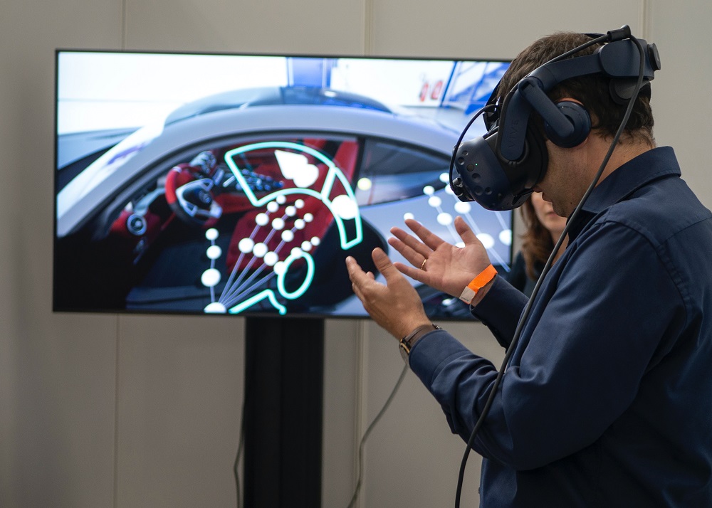 marketing in the metaverse. a man tries a VR car for the first time
